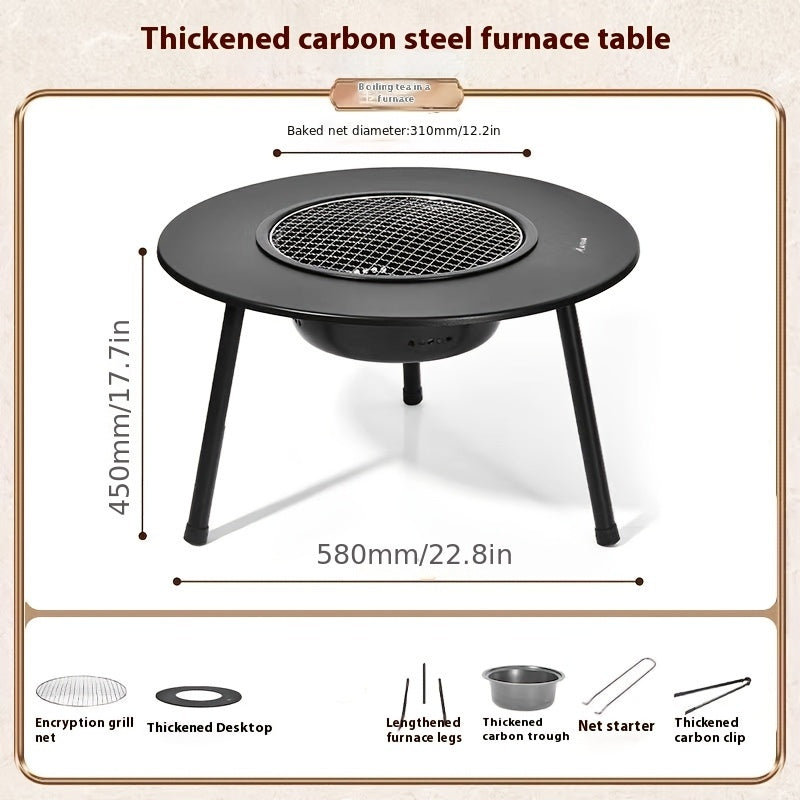 Utegrill med kol och tesetbord